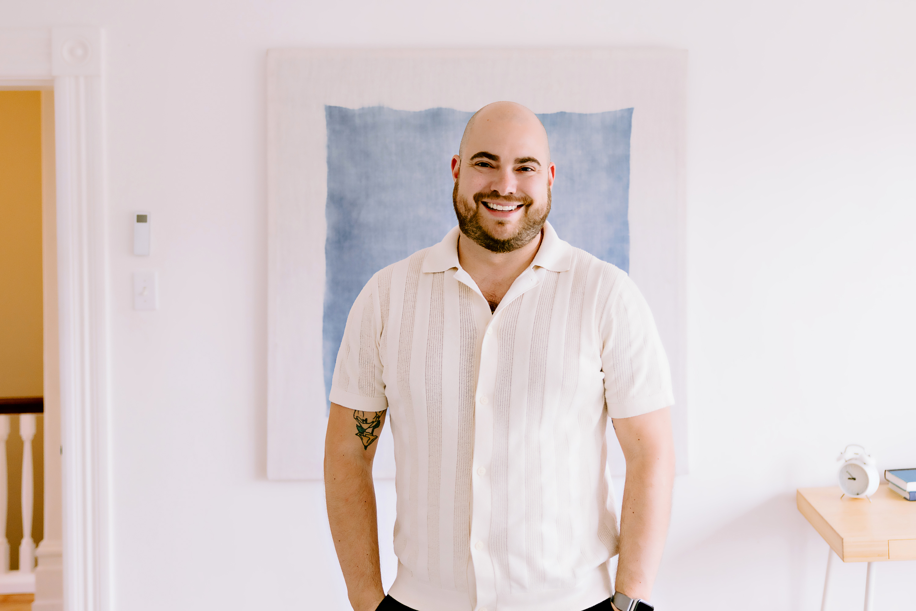 Daniel Souza wearing a white polo
